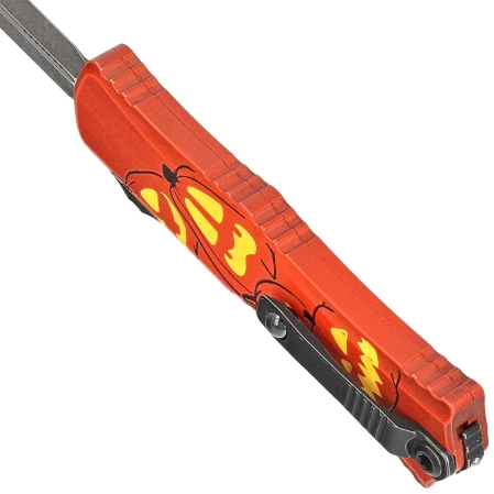 Nóż automatyczny OTF Microtech Hera II Mini D/E Signature Halloween Jack-o'-Lantern Aluminium, Satin M390MK by Tony and Sean Marfione (1702M-1HWJLS)